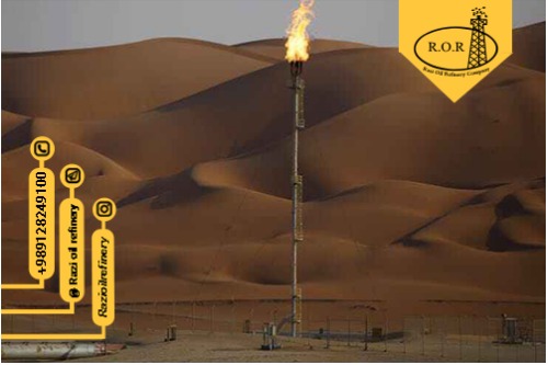 شعله های آتش در تاسیسات فرآوری روغن در میدان نفتی آرامکو عربستان در صحرای روب الخالی در شیبه ، عربستان سعودی 